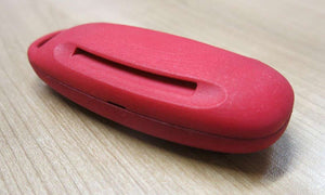 Photo d'un protège-clef sorti de l'imprimante 3D